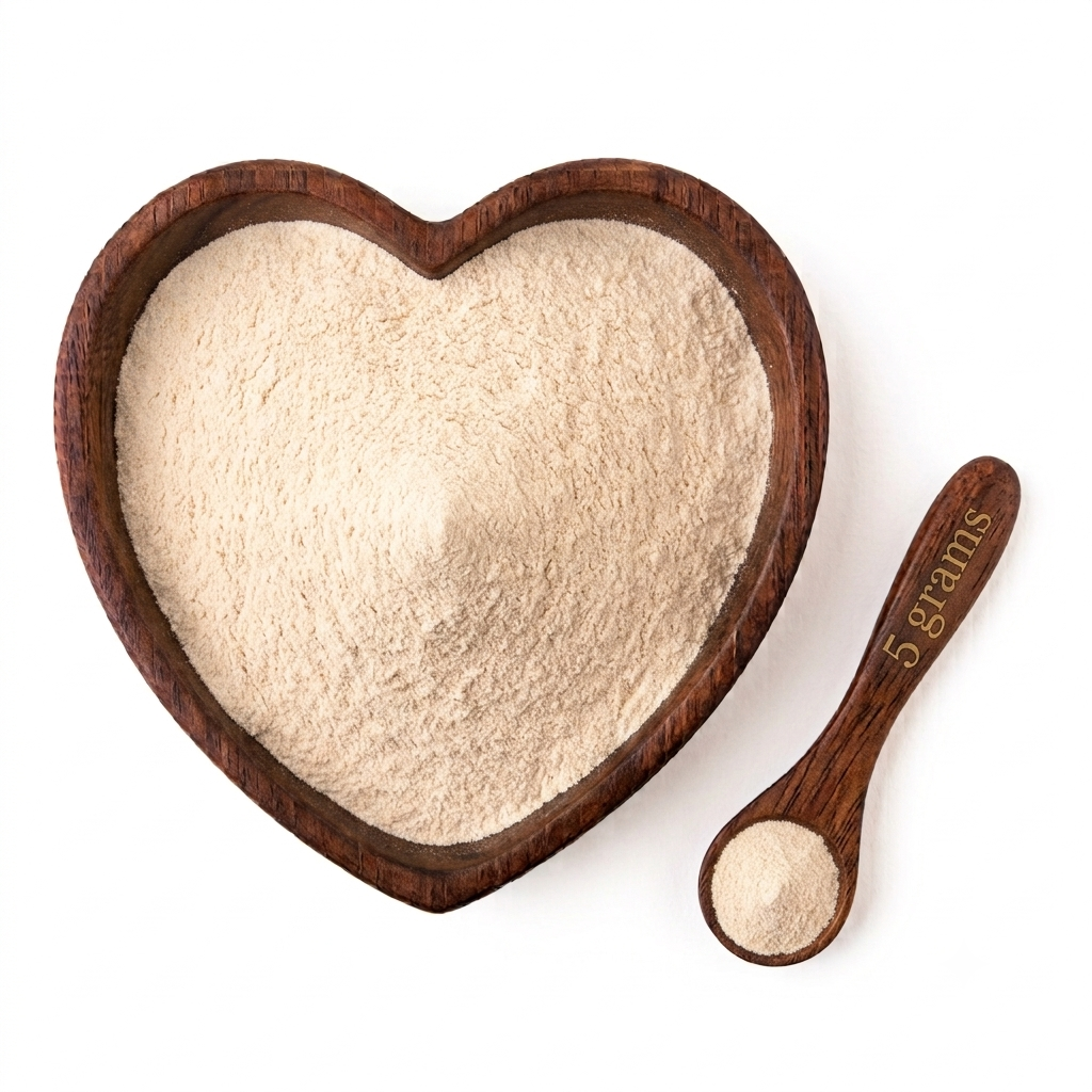 Heart-shaped wooden bowl filled with Organic Marine Sea Moss Powder and a 5-gram measuring spoon