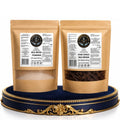 Marine Sea Moss Powder pouch and Raw Dried Sea Moss pouch displayed on a navy and gold tray against a white background.