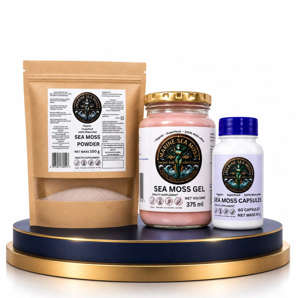 The Daily Sea Moss Stack Bundle featuring Marine Sea Moss Powder pouch, Sea Moss Gel jar, and Sea Moss Capsules bottle on a blue and gold display pedestal