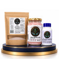 The Daily Sea Moss Stack Bundle featuring Marine Sea Moss Powder pouch, Sea Moss Gel jar, and Sea Moss Capsules bottle on a blue and gold display pedestal