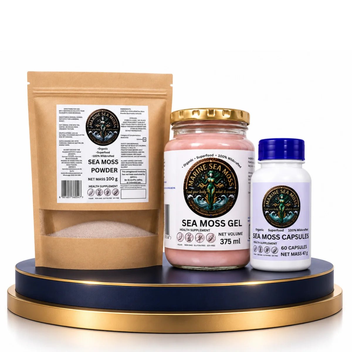 The Daily Sea Moss Stack Bundle featuring Marine Sea Moss Powder pouch, Sea Moss Gel jar, and Sea Moss Capsules bottle on a blue and gold display pedestal