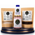 The Ultimate Marine Sea Moss Bundle featuring a Sea Moss Powder pouch, Sea Moss Gel jar, stacked Sea Moss Capsules bottle, and a Raw Dried Sea Moss pouch on a decorative blue and gold pedestal